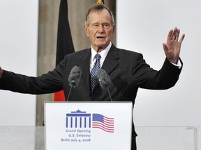 In this file photo taken on July 04, 2008 Former US president George Bush addresses guests during a ceremony to inaugurate the new US embassy building in Berlin. (Photo by JOHN MACDOUGALL/AFP/Getty Images)