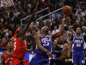 The Raptors' Pascal Siakam (left) gets called for a foul after knocking the ball from Philadelphia 76ers' Jimmy Butler on Wednesday night in Toronto. (Jack Boland/Toronto Sun)