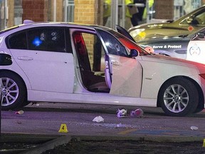 A car full of bullet holes marks the scene of a triple-shooting in an Etobicoke strip mall Friday night at Kipling Ave. and Rountree Rd. (John Hanley photo)