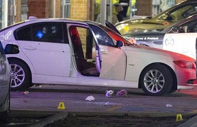 A car full of bullet holes marks the scene of a triple-shooting in an Etobicoke strip mall Friday night at Kipling Ave. and Rountree Rd. (John Hanley photo)