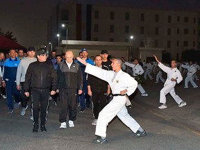 In this Dec. 16, 2018 photo released by the Egyptian Presidency, Egyptian President Abdel-Fattah el-Sissi inspects cadets during their morning exercises at the national Military Academy, in a suburb of Cairo, Egypt.