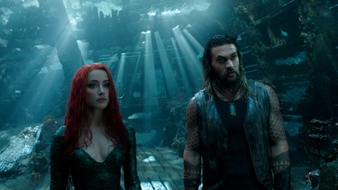 Aquaman (Jason Momoa), right, with Mera (Amber Heard) in  "Aquaman." DC Comics-Warner Bros. Pictures