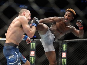 Hakeem Dawodu (R) of Canada fights against Kyle Bochniak of the United States in a featherweight bout during the UFC 231 event at Scotiabank Arena on Dec. 8, 2018 in Toronto.