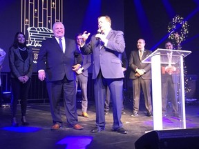 Dr. Charles McVety, president of the Canada Christian College, and Ontario Premier Doug Ford at the school's annual Christmas celebration on Sunday. (Joe Warmington/Toronto Sun)