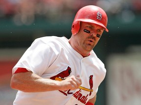Larry Walker of the St. Louis Cardinals rounds third base prior to scoring during a game against the Houston Astros at Busch Stadium in St. Louis, Mo. on July 17, 2005. (G. N. Lowrance/Getty Images)