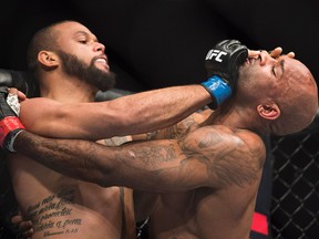 Jimi Manuw, right, fights Thiago Santos during the UFC light-heavyweight bout in Toronto on Saturday, Dec. 8, 2018.