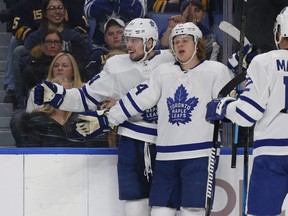 Toronto Maple Leafs forwards Auston Matthews (34) and Kasperi Kapanen (24) celebrate a goal during the second period of an NHL hockey game against the Buffalo Sabres, Tuesday, Dec. 4, 2018, in Buffalo N.Y. (AP Photo/Jeffrey T. Barnes)