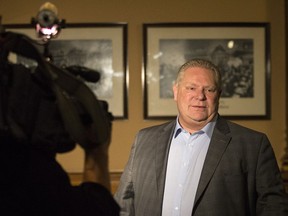 Ontario Premier Doug Ford leaves an early morning PC Caucus meeting at the Ontario Legislature in Toronto on Thursday, November 29, 2018.