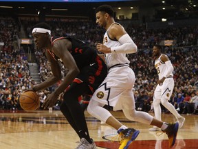 Raptors’ Pascal Siakam (left) is defended by the Nuggets’ Jamal Murray on Monday. The Raptors take on the 76ers on Wednesday.   
Jack Boland/Toronto Sun