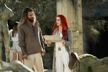 Jason Momoa and Amber Heard in a scene from "Aquaman." (Warner Bros.)