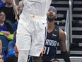 Phoenix Suns centre Deandre Ayton goes up for a shot in front of Orlando Magic guard Terrence Ross during the second half of an NBA game Wednesday, Dec. 26, 2018, in Orlando, Fla.