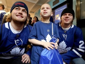 William Nylander and Kasperi Kapanen hang out with Blake Barter,7, during the annual Toronto Maple Leafs visit to Sick Kids Hospital in Toronto on Wednesday December 5, 2018. Dave Abel/Toronto Sun/Postmedia Network