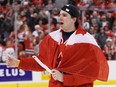 John Tavares of Team Canada skates with a Canadian flag wrapped around him during post game ceremonies after defeating Team Sweden at the Gold Medal Game of the IIHF World Junior Championships at Scotiabank Place on Jan. 5, 2009 in Ottawa.