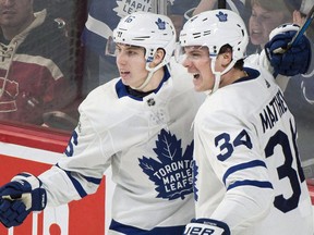 Toronto Maple Leafs' Auston Matthews (34) celebrates with teammate Mitchell Marner after scoring against the Montreal Canadiens during third period NHL hockey action in Montreal on November 18, 2017.