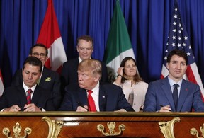 Prime Minister Justin Trudeau, U.S. President Donald Trump, and Mexico’s President Enrique Pena Neto, participate in the USMCA signing ceremony, Friday, Nov. 30, 2018 in Buenos Aires, Argentina.