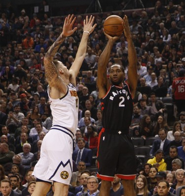 Toronto Raptors Kawhi Leonard SF (2) shots past Denver Nuggets Juan Hernangomez (41) during the first half in Toronto, Ont. on Monday December 3, 2018. Jack Boland/Toronto Sun/Postmedia Network