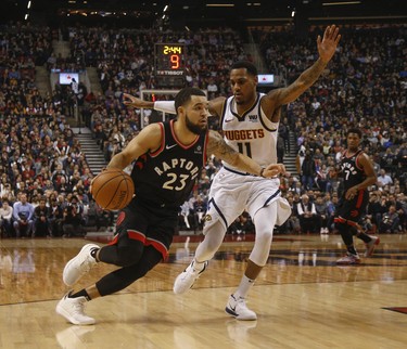 Toronto Raptors Fred VanVleet PG (23) tries to get past Denver Nuggets Monte Morris PG (11) during the first half in Toronto, Ont. on Monday December 3, 2018. Jack Boland/Toronto Sun/Postmedia Network