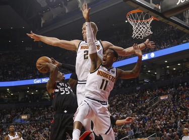 Denver Nuggets Brandon Goodwin PG (2) and teammate Monte Morris PG (11) defence against Toronto Raptors Delon Wright PG (55) during the first half in Toronto, Ont. on Monday December 3, 2018. Jack Boland/Toronto Sun/Postmedia Network