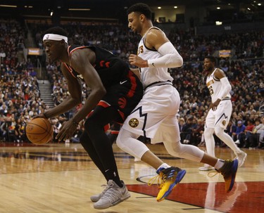 Toronto Raptors Pascal Siakam PF (43) is defended by Denver Nuggets Jamal Murray PG (27) during the first half in Toronto, Ont. on Monday December 3, 2018. Jack Boland/Toronto Sun/Postmedia Network