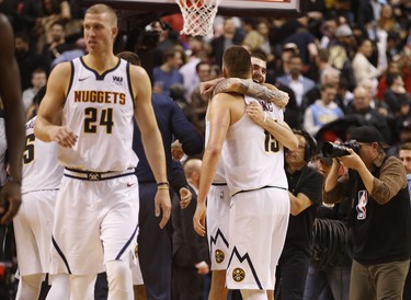 Denver Nuggets Nikola Jokic C (15) is congratulated after winning the game 106-103. Jokic had 23 points on the night in Toronto, Ont. on Tuesday December 4, 2018. Jack Boland/Toronto Sun/Postmedia Network
