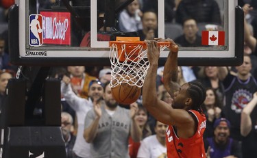 Toronto Raptors Kawhi Leonard SF (2) slams the ball during the first quarter in Toronto, Ont. on Thursday December 6, 2018. Jack Boland/Toronto Sun/Postmedia Network