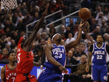 Toronto Raptors Pascal Siakam PF (43) gets a foul after knocking the ball from Philadelphia 76ers Jimmy Butler SG (23) during the second quarter in Toronto, Ont. on Thursday December 6, 2018. Jack Boland/Toronto Sun/Postmedia Network