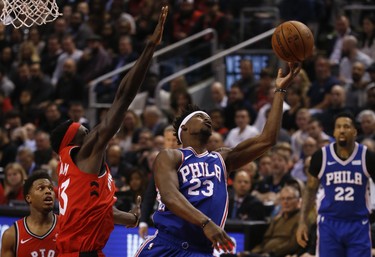 Toronto Raptors Pascal Siakam PF (43) gets a foul after knocking the ball from Philadelphia 76ers Jimmy Butler SG (23) during the second quarter in Toronto, Ont. on Thursday December 6, 2018. Jack Boland/Toronto Sun/Postmedia Network