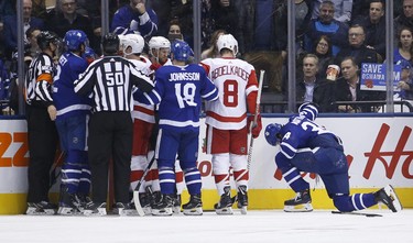 Toronto Maple Leafs Auston Matthews C (34) gets up slowly after being run into the boards during the second period in Toronto on Thursday December 6, 2018. Jack Boland/Toronto Sun/Postmedia Network