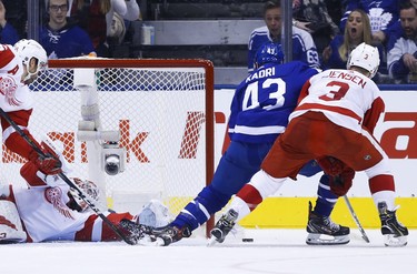 Detroit Red Wings Jonathan Bernier G (45) stretches out to rob Toronto Maple Leafs Nazem Kadri C (43) during the second period in Toronto on Friday December 7, 2018. Jack Boland/Toronto Sun/Postmedia Network