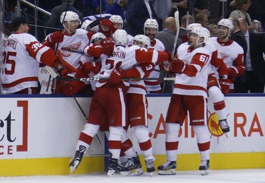 Detroit Red Wings Dylan Larkin C (71) scores the winner in OT  in Toronto on Friday December 7, 2018. Jack Boland/Toronto Sun/Postmedia Network