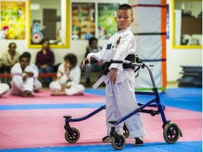 Liam Marriage, 8, during his taekwondo test for a yellow belt at Variety Village in Toronto, Ont. on Wednesday December 5, 2018. His muscle joint condition - Arthrogryposis multiplex congenita (AMC) - results in all four joints being frozen and stiff.  Ernest Doroszuk/Toronto Sun/Postmedia