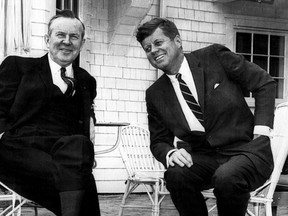 Canadian Prime Minister Lester Pearson warms his hands in his pockets as he chats with President John Kennedy for benefit of photographers on terrace of President's summer home at Hyannis Port on Cape Cod, May 10, 1963. The Canadian Press/AP)