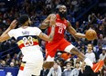 Houston Rockets guard James Harden passes the ball around New Orleans Pelicans' Anthony Davis last week. (AP PHOTO)