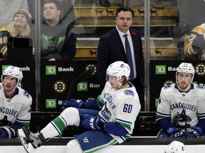 Vancouver Canucks coach Travis Green watches from the bench during a game in Boston earlier this season. (AP PHOTO)