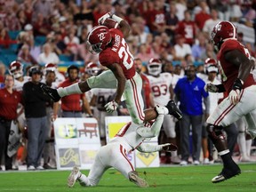 Najee Harris #22 of the Alabama Crimson Tide carries the ball against the Oklahoma Sooners during the College Football Playoff Semifinal at the Capital One Orange Bowl at Hard Rock Stadium on December 29, 2018 in Miami, Florida.  (Photo by Mike Ehrmann/Getty Images)