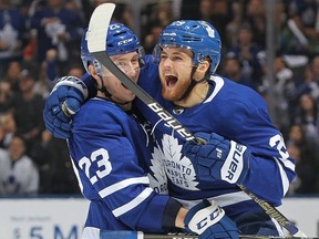 William Nylander #29 of the Toronto Maple Leafs celebrates his 1st goal of the season against the Minnesota Wild with teammate Travis Dermott #23 during the Next Generation NHL game at Scotiabank Arena on January 3, 2019 in Toronto, Ontario, Canada.