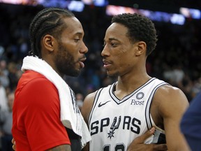 SAN ANTONIO, TX - JANUARY 3:  DeMar DeRozan #10 of the San Antonio Spurs greets Kawhi Leonard #2 of the Toronto Raptors at the end of the game at AT&T Center on January 3, 2019 in San Antonio, Texas.  NOTE TO USER: User expressly acknowledges and agrees that , by downloading and or using this photograph, User is consenting to the terms and conditions of the Getty Images License Agreement. (Photo by Ronald Cortes/Getty Images)
