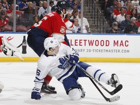 Aaron Ekblad #5 of the Florida Panthers takes Mitch Marner #16 of the Toronto Maple Leafs to the ice in front of the net during second period action at the BB&T Center on January 18, 2019 in Sunrise, Florida. (Photo by Joel Auerbach/Getty Images)