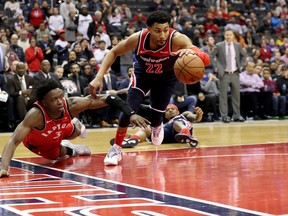 Wizards’ Otto Porter Jr. steals the ball from the Raptors’ OG Anunoby on Sunday. The Raps won in double overtime. Getty Images