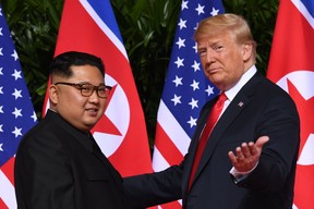 President Donald Trump (R) and North Korean leader Kim Jong Un.Trump and Kim will hold a summit “near the end of February,” the White House said on Jan. 18, 2019. (AFP/Getty Images)