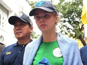 Detained Belarusian model Anastasia Vashukevich (R) known by her pen name Nastya Rybka leaves Thai immigration department in Bangkok on January 17, 2019 during her deportation. (AFP/Getty Images