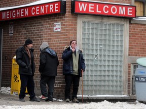 Men await entrance to the Maxwell Meighen Centre in Toronto on Jan. 22, 2019. (Dave Abel, Toronto Sun)
