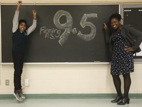 Principal Denis Humphreys with Grade 7 student Aaran Mayooran at Fleming Public School in Malvern, a TDSB school that scored a 9.5 out of 10 in the Fraser Institute's Report Card on Elementary Schools in Ontario 2019, on Tuesday, Jan. 15, 2019. (Jack Boland/Toronto Sun/Postmedia Network)