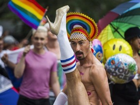 A parade participant gets a leg up during last year’s Pride parade on June 24, 2018. (Ernest Doroszuk, Toronto Sun)