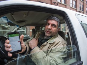 Mehdi Kiawer, was given a ticket for holding his phone in his hand while driving along Richmond St. E., he was not talking on the phone. This is the first day of the Distracted Driving campaign in Toronto, Ont. on Monday January 14, 2019. (Ernest Doroszuk/Toronto Sun/Postmedia)