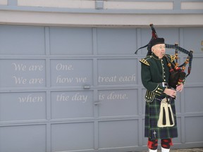 Bagpiper Bob Stobie, of the Willowdale Legion Branch 66 Pipe Band, played a lament in front of 53 Mallory Cr., where eight slain men's remains were found in planters leading to first-degree murder charges against Bruce McArthur, on Friday, Jan. 18, 2019. (Jack Boland/Toronto Sun/Postmedia Network)
