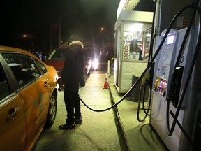Filling up along Kingston Rd. (Veronica Henri, Toronto Sun)