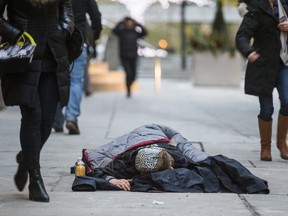 A homelss person is pictured on a sidewalk on Jan. 25, 2019 in the Yonge-King Sts. area last .
9. Ernest Doroszuk/Toronto Sun