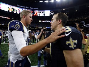 New Orleans Saints quarterback Drew Brees (right) faces off with Los Angeles Rams quarterback Jared Goff on Sunday. (AP PHOTO)