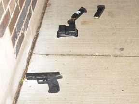 The Smith and Wesson .40 calibre handgun with two full handgun magazines and a magazine holder, which were located against the wall of the Danforth Church and next to Faisal Hussain's body. (SIU)